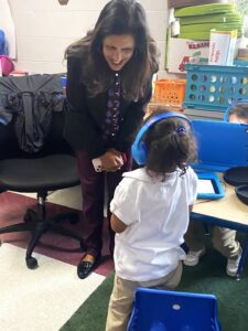 Swati Adarkar speaking with a young student.