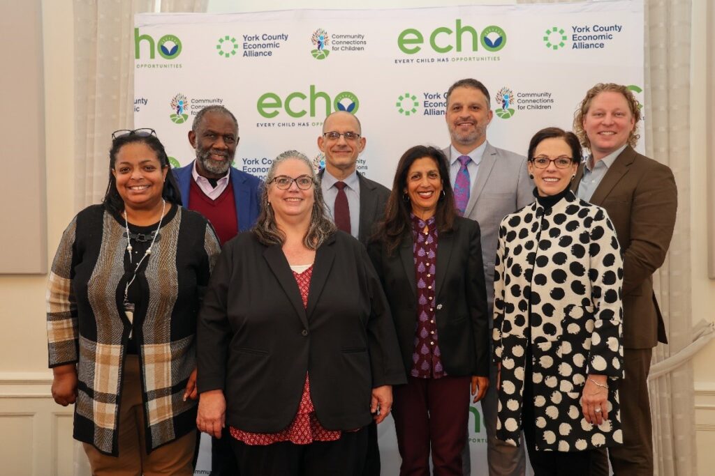 A group photo of people that includes Dr. Andrea Berry-Brown, Ralph Smith, David Jacobson, and Swati Adarkar.