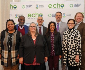 A group photo of people that includes Dr. Andrea Berry-Brown, Ralph Smith, David Jacobson, and Swati Adarkar.