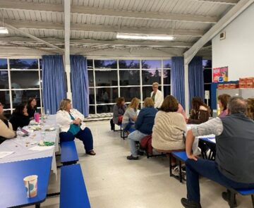 A meeting in a school room of educators.