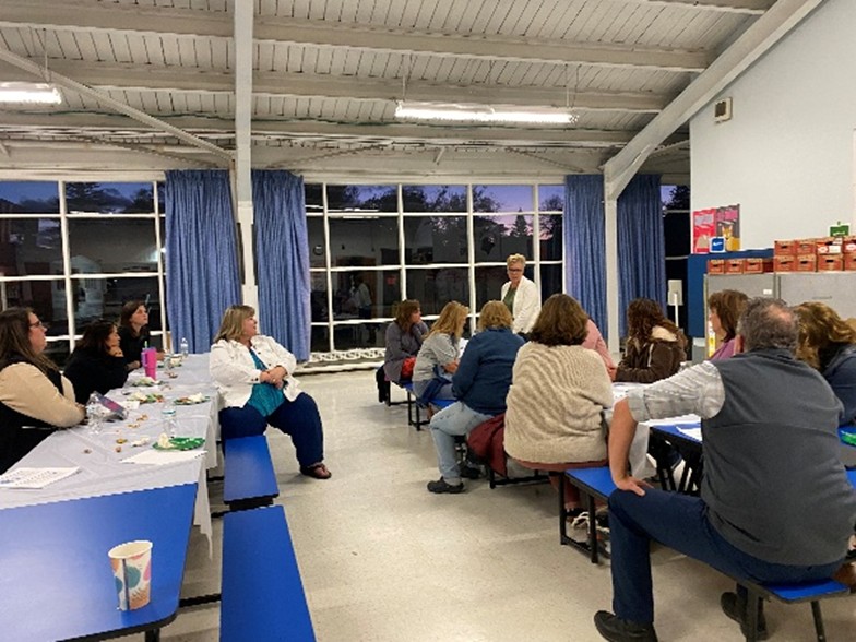 A meeting in a school room of educators.