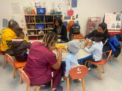 Families at school working around a table